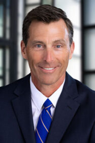 A man poses for a professional photo.